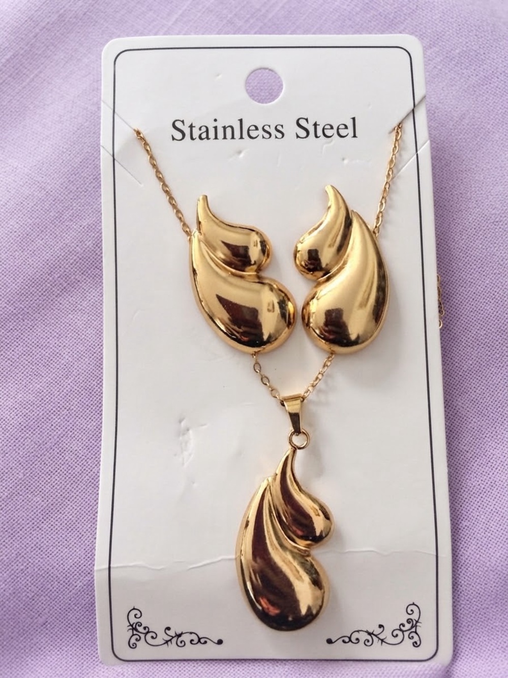 Women’s Gold Teardrop Stainless Steel Necklace and Earring Set.